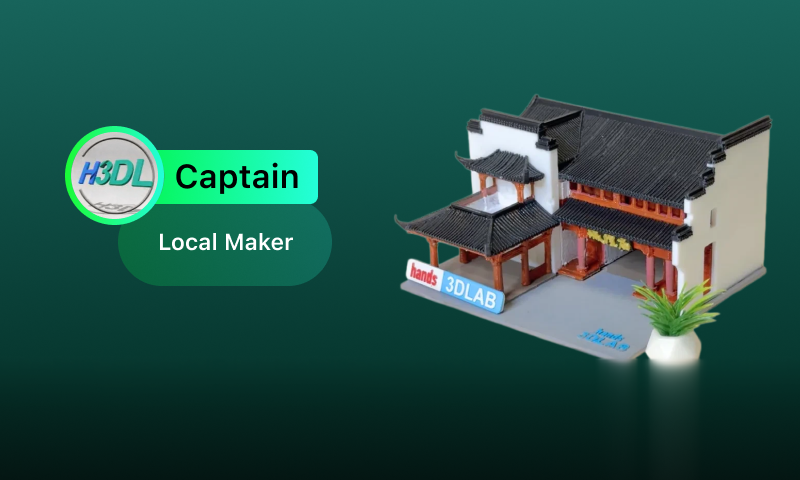 3D printed Luzhou landmarks: Bao Zheng statue, church, and bamboo chair on a maker's workbench